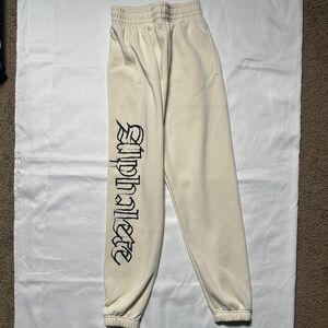 Alphalete Off-White Joggers with Black Logo